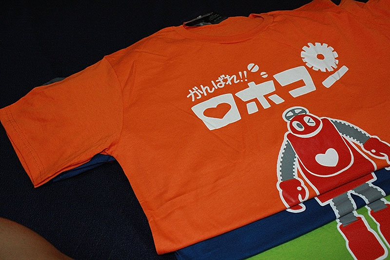 T-Shirt เสื้อยืดกันดั้ม โรโบคอนเจ้าหุ่นจอมยุ่ง (Zaku II) สุดเท่ห์ สีส้ม จากร้าน GUNZU !!โปรโมชั่น